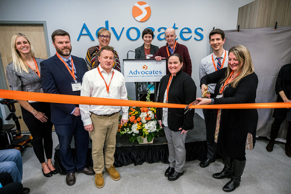 Advocates Behavioral Health team members cutting the ribbon at the grand opening of Advocates Community Behavioral Health Center