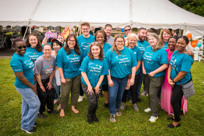 Large group of Advocates staff gathered outdoors.