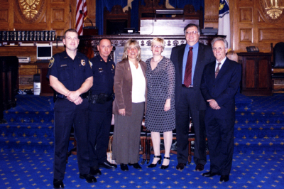 Jail Diversion team and police partners with Karen Spilka in a courthouse.